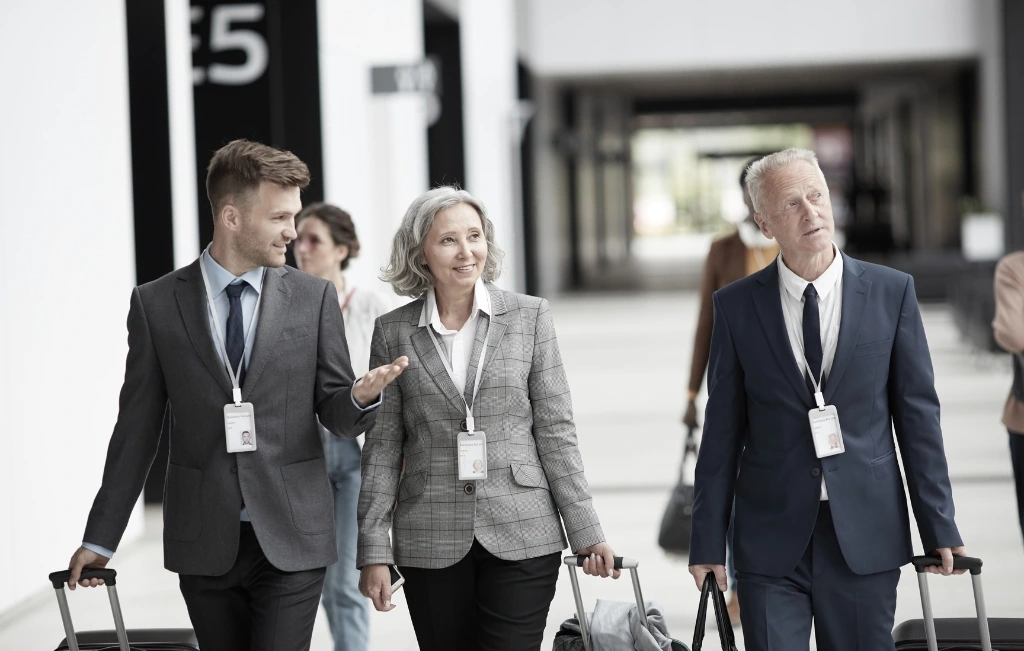 Business representatives walking towards their Shanghai airport transfer service