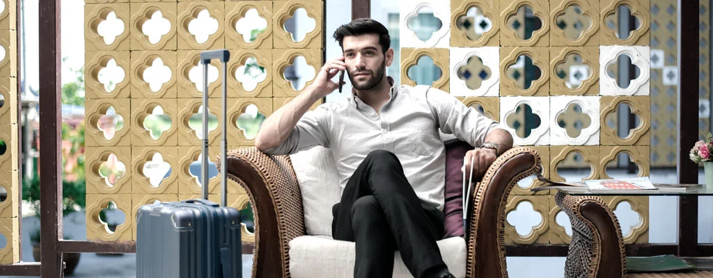 businessman at hotel lobby waiting for airport transfer pickup service