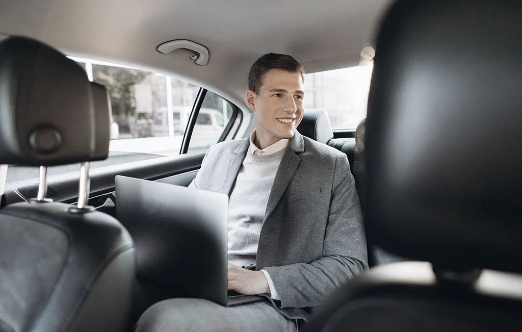 businessman-traveling-from-the-airport-onboard-airport-car-service