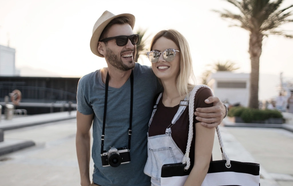 couple in harbor waiting for their cruise transfer