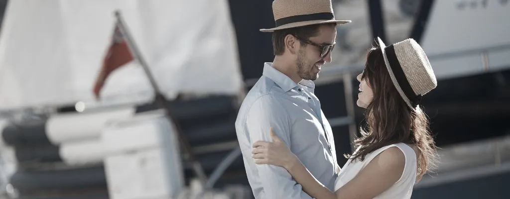 couple looking at each other infront of cruise port