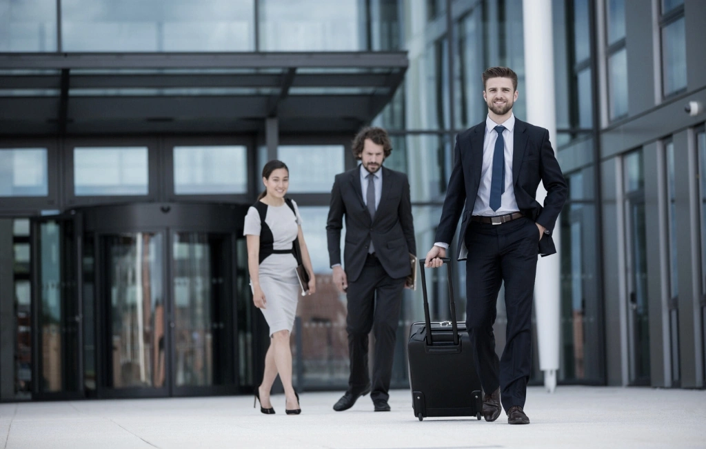 group of business professionals arriving at the airport