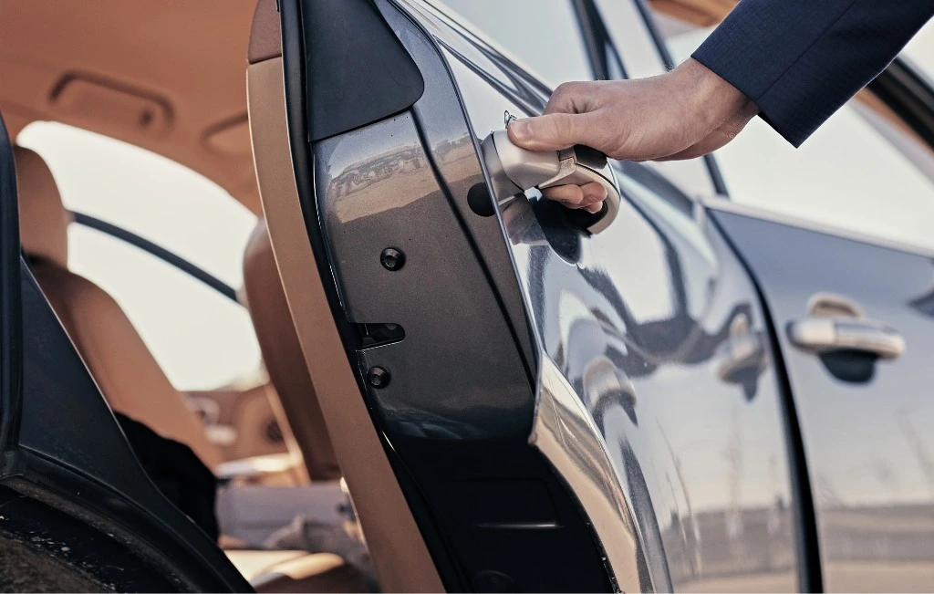 man holding the car door