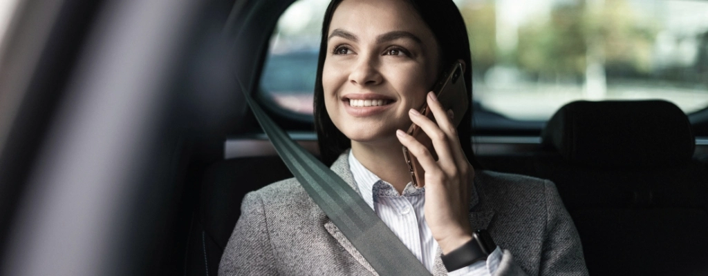 woman on the phone during airport transfer service